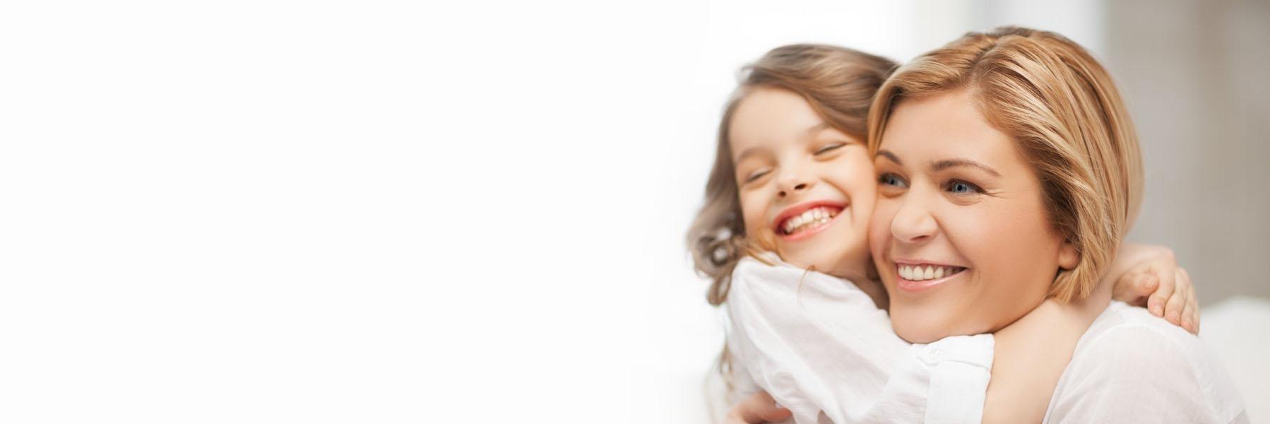 Young family smiling l Dentist Temple TX